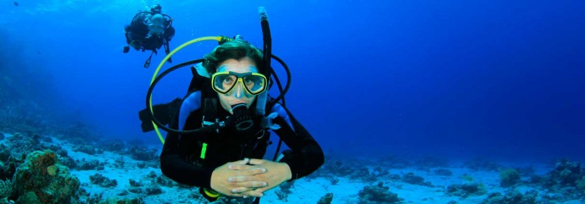 A scuba diver, diving in the sea off Southern Crete